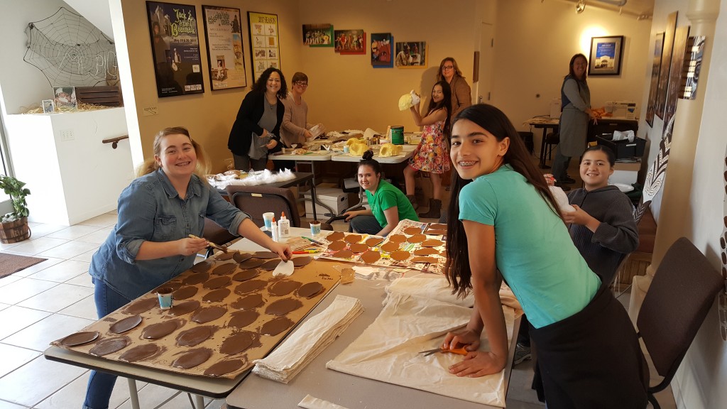 Volunteers of all ages help to create costumes for the upcoming production of Disney's Lion King KIDS.